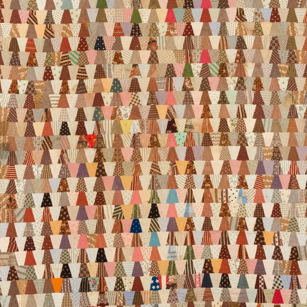 charm quilt top made of rows of trapezoids