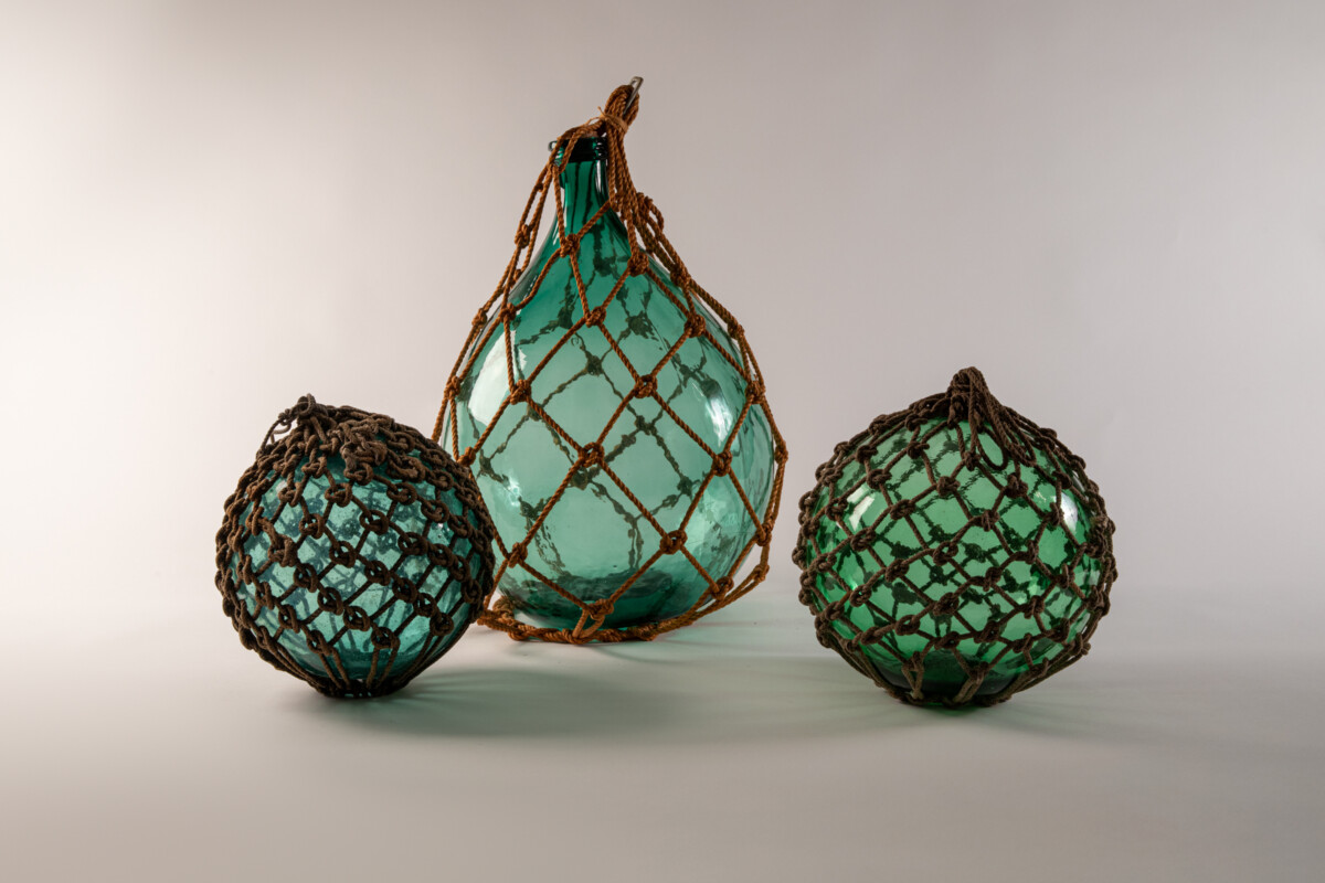 Unidentified Makers, Fishing Floats, 20th century. blown glass and hemp rope (asa). Japan.  various sizes.  Museum Purchase, 2001-38-001 and 2001-38-002; Gift of Yoshi Hug, 2003-41-001.