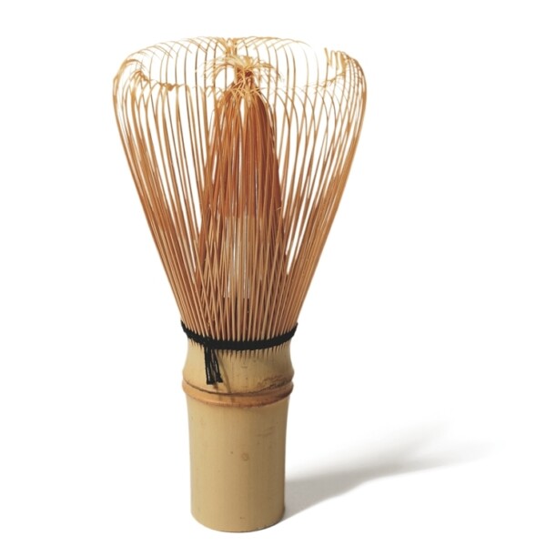 This tea whisk is less than five inches long. It was made from a single piece of bamboo that was split with a knife into inner and outer tines.