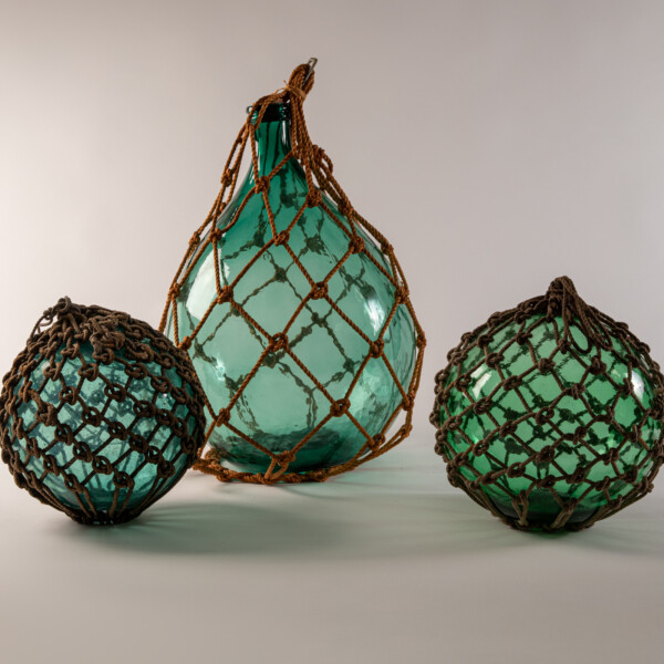 Unidentified Makers, Fishing Floats, 20th century. blown glass and hemp rope (asa). Japan.  various sizes.  Museum Purchase, 2001-38-001 and 2001-38-002; Gift of Yoshi Hug, 2003-41-001.