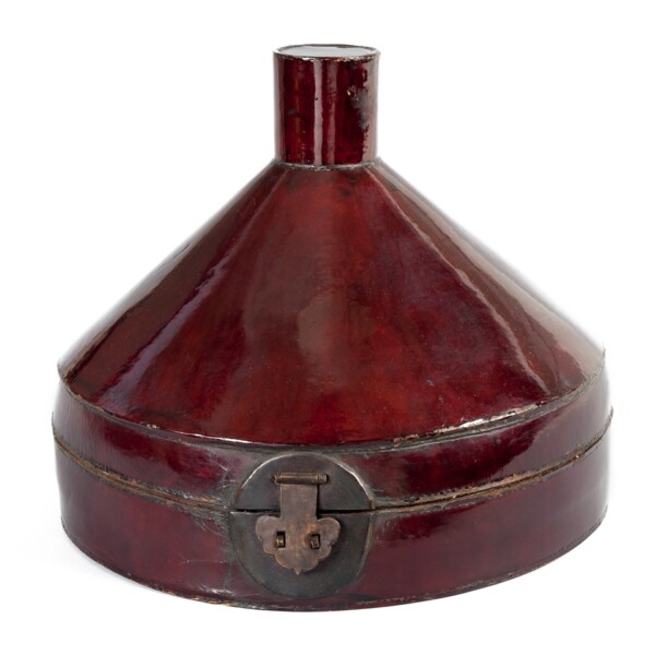 This lacquered leather and brass hat storage box was made for a Qing official’s court hat, and includes a round jewel insignia at the top.