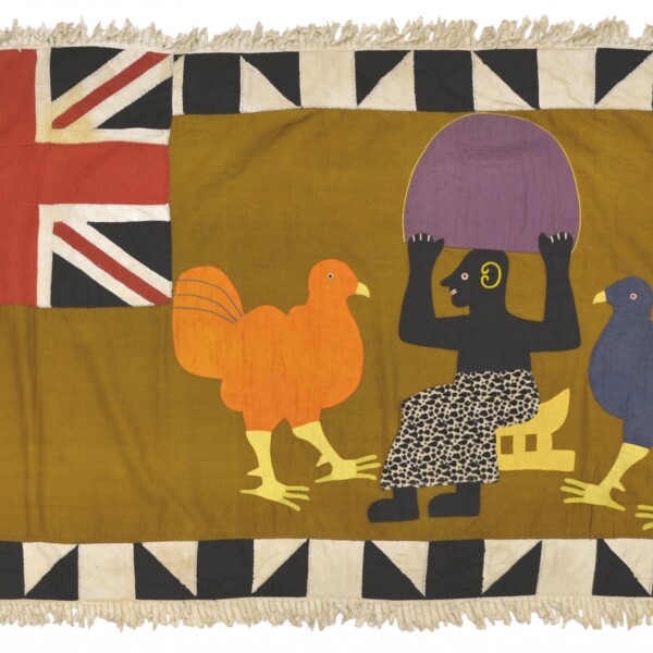 Depicted on this textile is a male figure seated on a king’s stool holding a large fan. There are also two large birds on either side of him which may represent members of the company. This flag also contains a large Union Jack and a graphic black and white border composed of alternating squares and triangles.