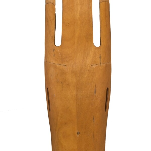This “plyformed wood” leg splint was designed as a valuable contribution to World War II by Charles and Ray Eames. It was made from one piece of wood bonded by resin glue and shaped by heat and pressure. This splint was designed to fit the shape of the user's buttocks, thigh, calf, and heel.