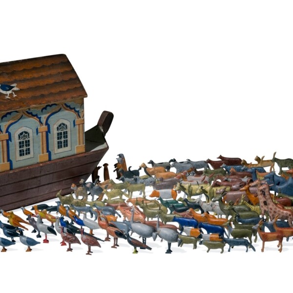 This Ark has over 200 animals made in the Alpine region of Germany, which has been a center of wooden toy making for several hundred years. This ark was made in a small factory, and has an access panel so the animals can be stored inside. The dove with an olive branch in its beak on the roof of the houseboat is a reference to the story of Noah.