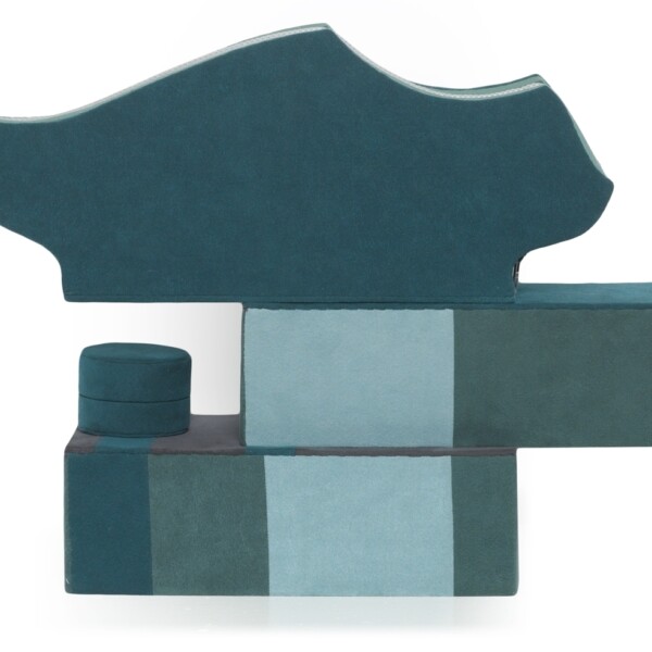 This water tower also contains a beaded bag, scarf, netting necklace, and tape necklace when open. This water tower bag is teal and light blue and abstractly depicts a water tower.